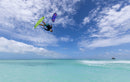 Rider haciendo un truco de freestyle con la Duotone Dice SLS 2027 bajo un cielo con nubes
