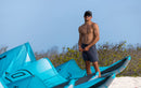 Edgar Ulrich riding the Duotone Evo D/LAB 2027 off a tropical beach