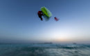 Reno Romeu jumping with the Duotone Evo SLS 2027 over the sea at dusk
