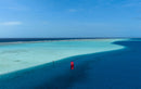 Aerial drone view of the Duotone Evo SLS 2027 over a tropical lagoon