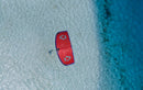 Rider on the red and purple Duotone Evo SLS 2027 over a tropical lagoon, same model as the Concept Blue