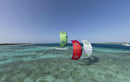 Three Duotone Evo SLS 2027 kites in different colours riding over a tropical lagoon, same model as the Concept Blue