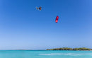 Reno Romeu riding the Duotone Evo SLS 2027 over a turquoise tropical lagoon, same model as the Concept Blue