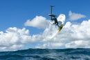 Rider girando en el aire con el Duotone Unit SLS Concept Blue 2027 bajo las nubes