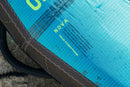 Dettaglio del tessuto N-RS3 Turquoise e del logo Nova della wing North Nova 2026