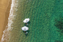 Aerial view of two riders with North Nova Pro 2026 wings over turquoise water