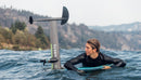 North Sonar UHM-FD mast with integrated motor pod next to a rider in the water